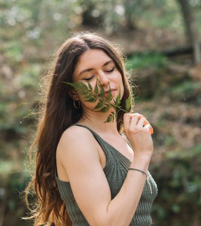 young-woman-smelling-leaf-forest_23-2148192715 young-woman-smelling-leaf-forest_23-2148192715